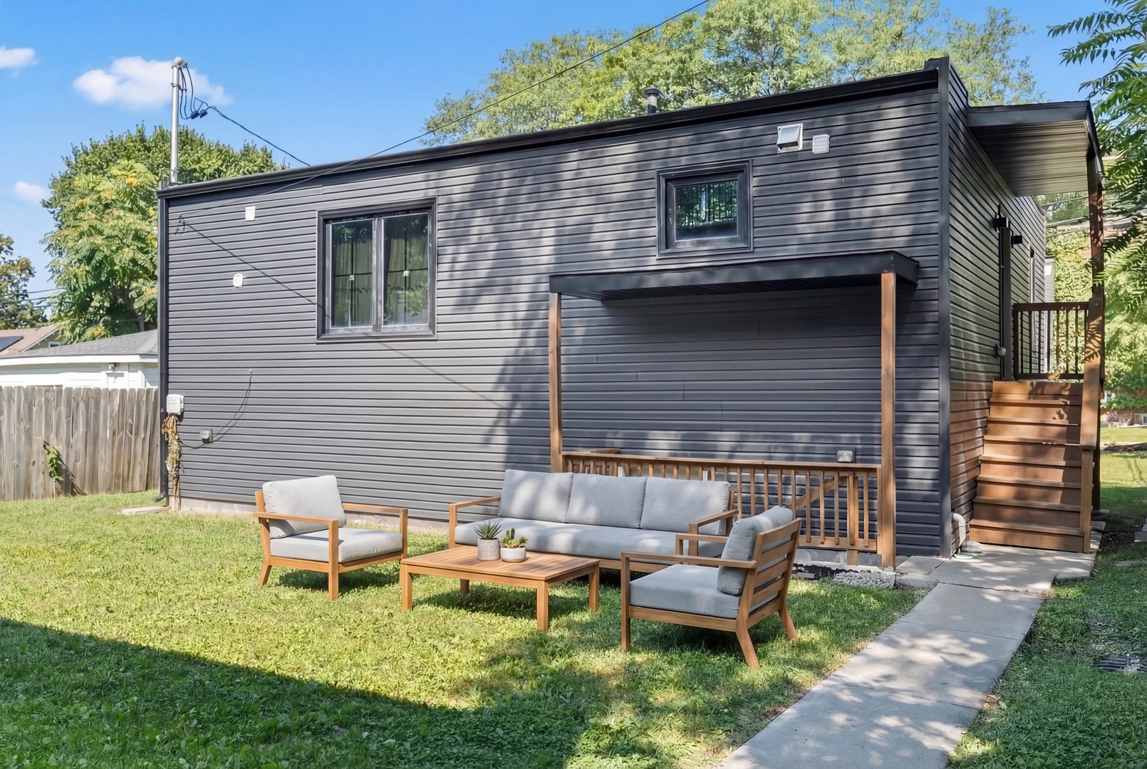 2307 Lake Street, Unit 2 Evanston, IL 60201 - Photo 2 of 20 a backyard of a house with table and chairs