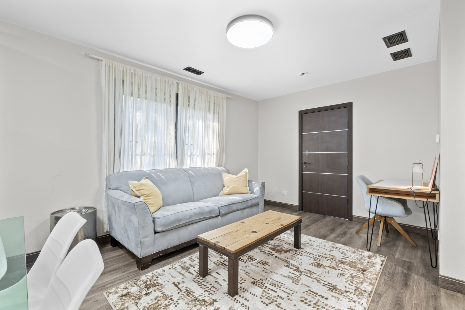 2307 Lake Street, Unit 2 Evanston, IL 60201 - Photo 10 of 20 a living room with furniture a rug and a window