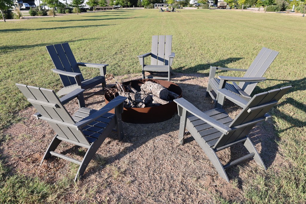 4584 Highway 290, Unit 252 Fredericksburg, TX 78624 - Photo 13 of 16 a view of a terrace with lawn chairs and ocean view