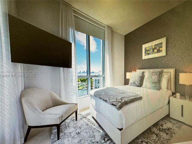 a living room with a couch and a flat screen tv