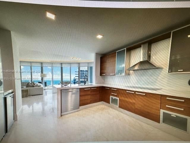 a kitchen with a sink and wooden cabinets