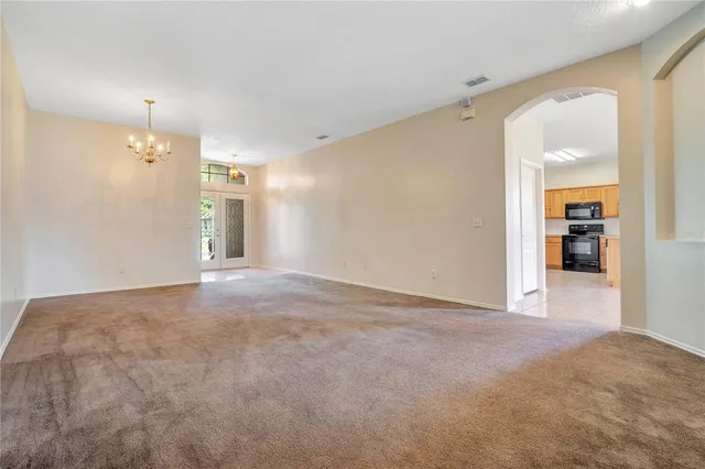 a view of a big room with closet and windows