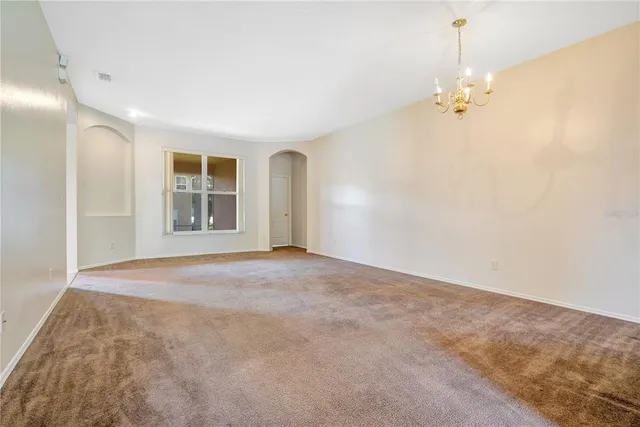 a kitchen with a refrigerator and a sink