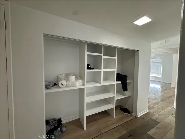 a view of an empty room with a closet