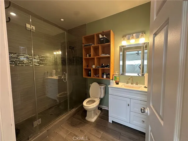 a kitchen with granite countertop a refrigerator and a stove top oven