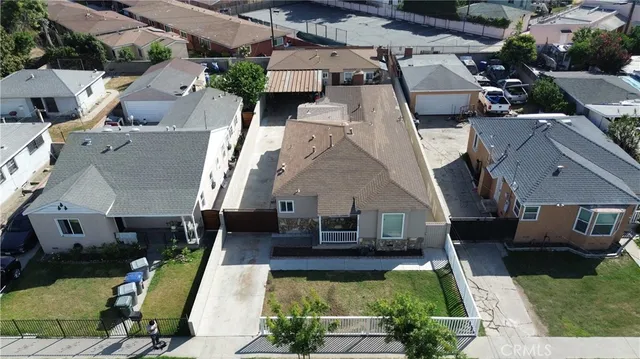 an aerial view of houses with outdoor space