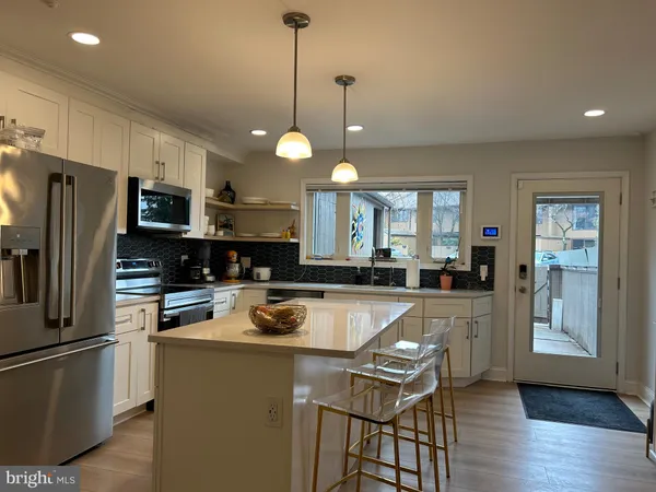 a kitchen with counter space cabinets and appliances