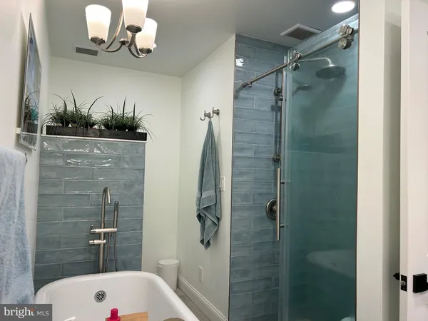a bathroom with a sink vanity and a mirror
