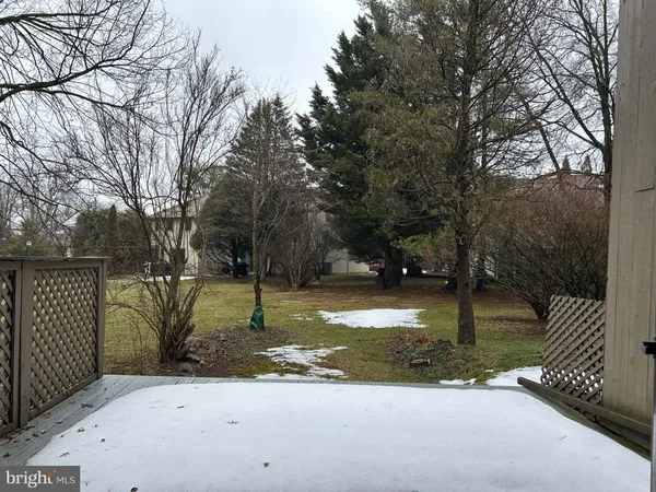 a view of a street with a yard