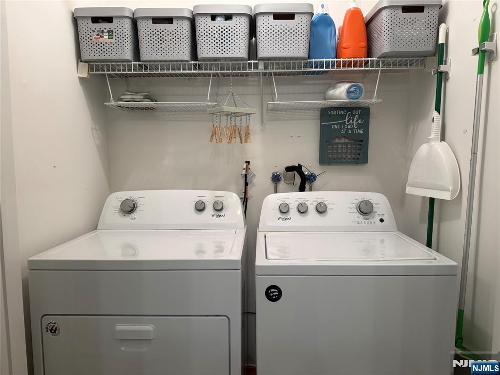 2308 Hemingway Lane, Unit 2308 Mahwah, NJ 07430 - Photo 12 of 16 a utility room with dryer and washer