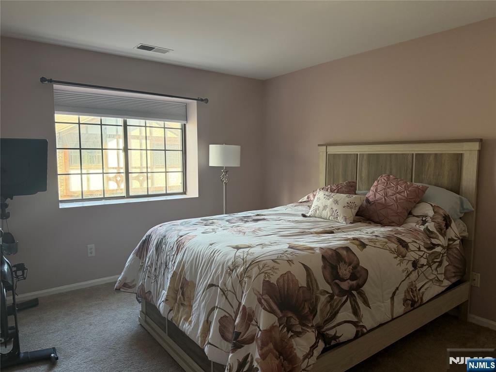 2308 Hemingway Lane, Unit 2308 Mahwah, NJ 07430 - Photo 9 of 16 a bedroom with a bed and window
