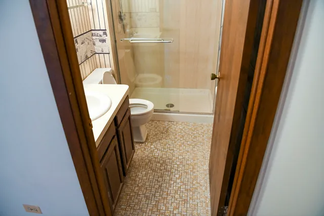 a bathroom with a tub and a shower