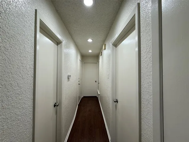 a view of a bathroom from a hallway