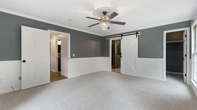 a view of an empty room with windows