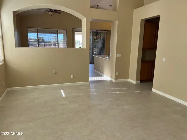 a kitchen with a refrigerator and a sink