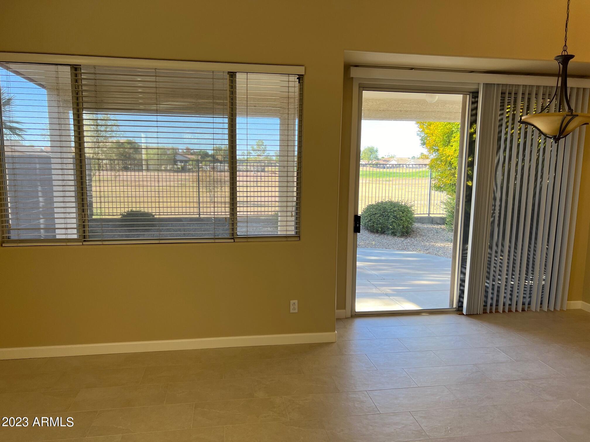 924 South Roanoke Street Gilbert, AZ 85296 - Photo 4 of 6 a view of an empty room with a window