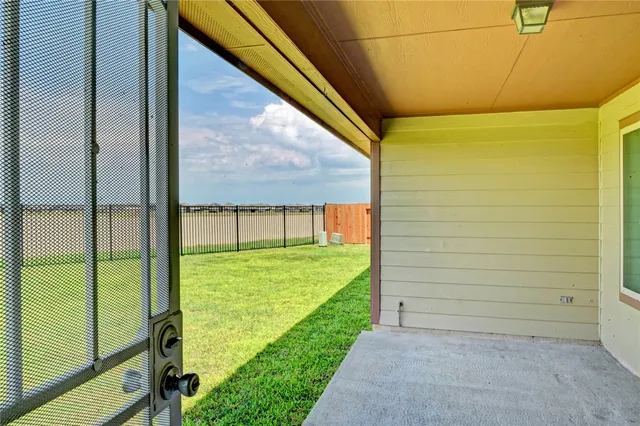 a view of a back yard from a balcony