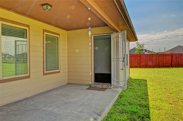 a view of an house with backyard and garage