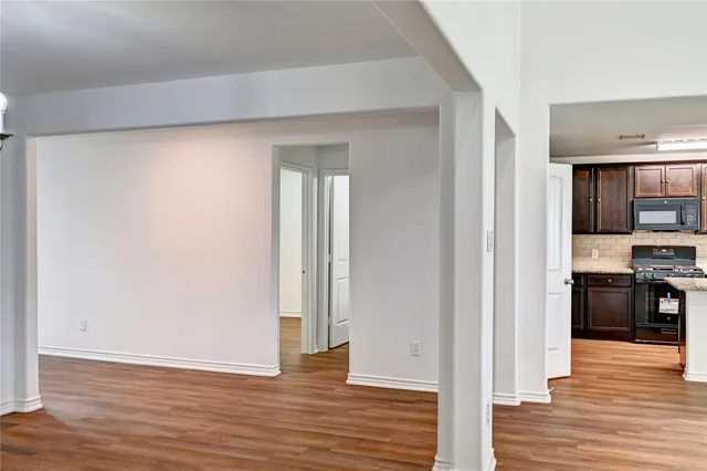 a view of a kitchen from the hallway