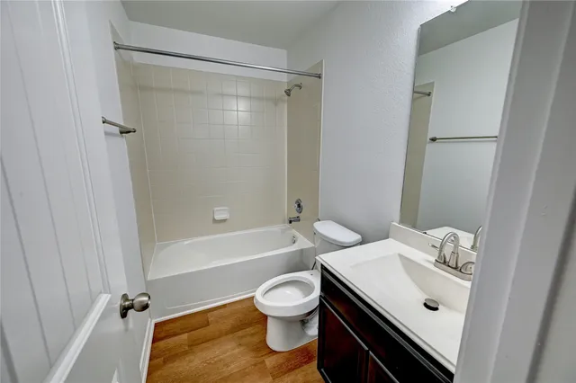 a bathroom with a sink a toilet and a bathtub