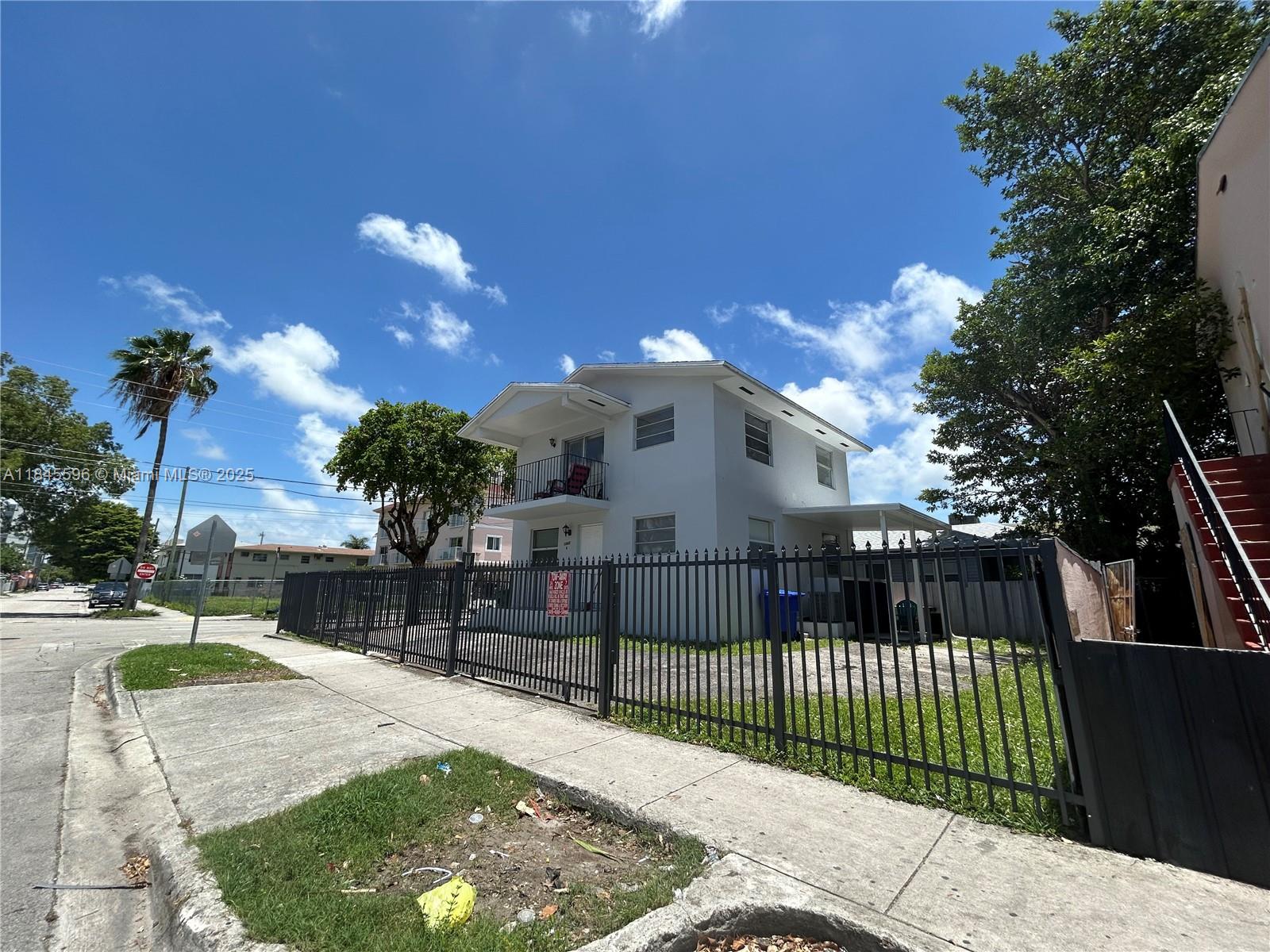 1068 Southwest 2nd Street Miami, FL 33130 - Photo 2 of 5 a view of a house with a balcony