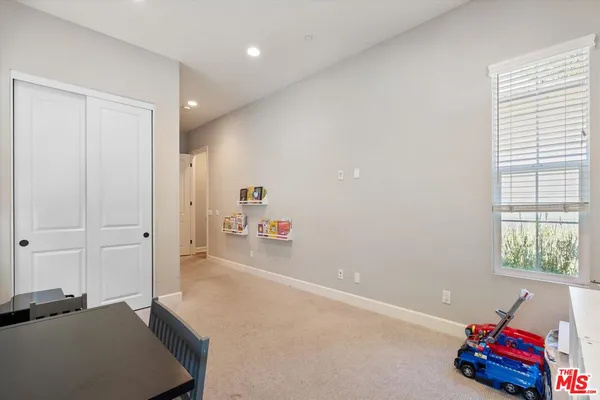 a view of a livingroom with furniture and white walls