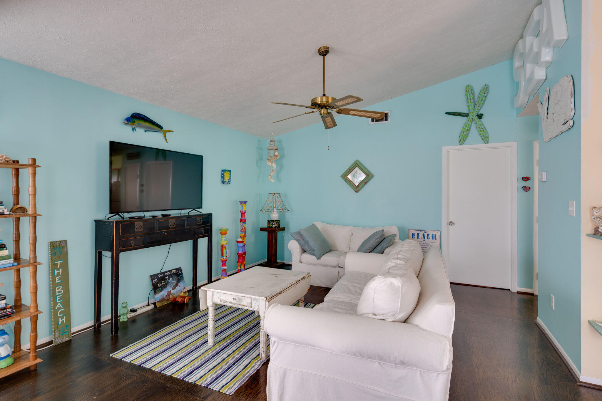 80 Buddy Street Santa Rosa Beach, FL 32459 - Photo 12 of 46 a living room with furniture and a flat screen tv