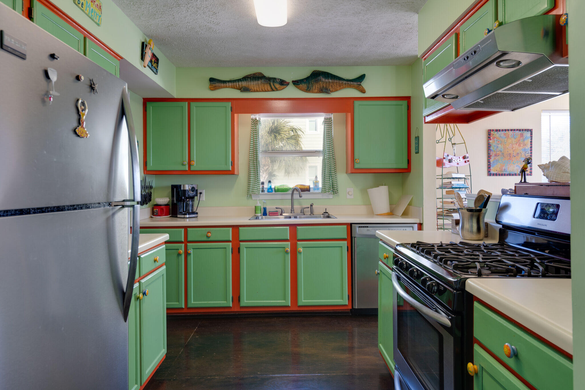 80 Buddy Street Santa Rosa Beach, FL 32459 - Photo 17 of 46 a kitchen with kitchen island a sink stove and refrigerator