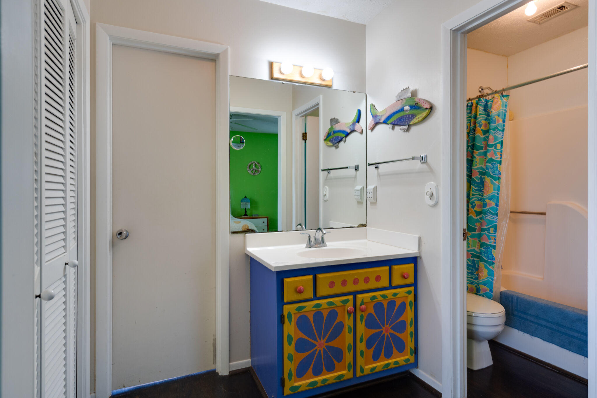 80 Buddy Street Santa Rosa Beach, FL 32459 - Photo 23 of 46 a bathroom with a sink mirror vanity and toilet