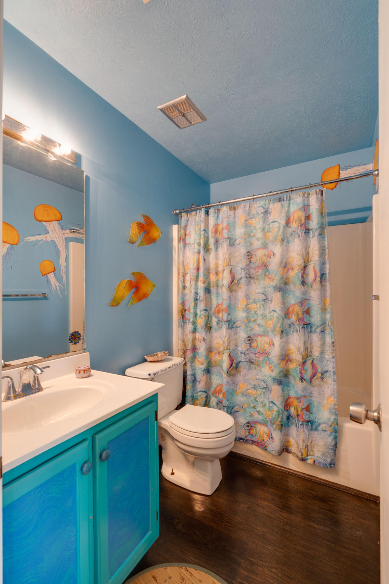 80 Buddy Street Santa Rosa Beach, FL 32459 - Photo 27 of 46 a bathroom with a sink a toilet and shower curtain