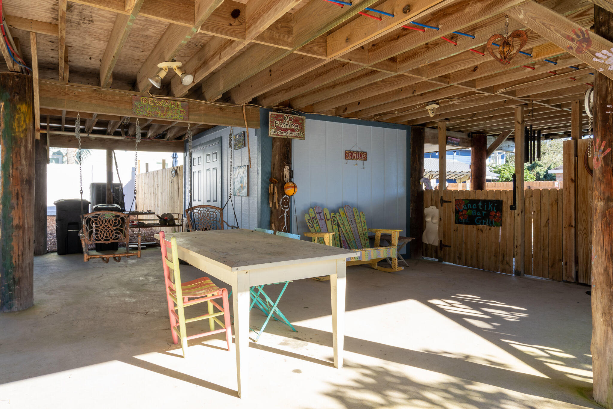 80 Buddy Street Santa Rosa Beach, FL 32459 - Photo 28 of 46 a view of a porch with furniture and a table