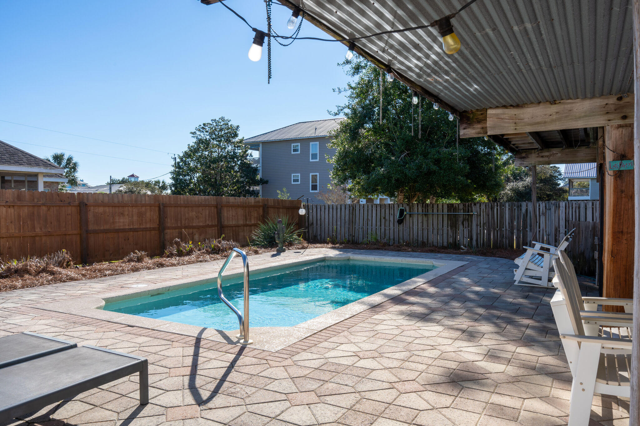 80 Buddy Street Santa Rosa Beach, FL 32459 - Photo 6 of 46 a backyard with a table and chairs