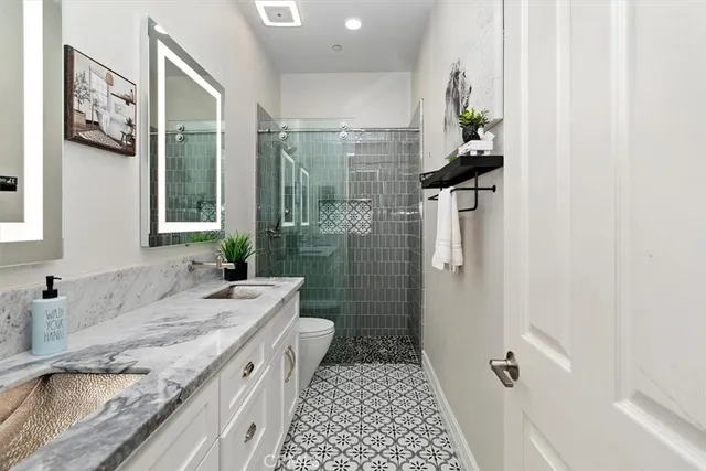 a bathroom with a sink double vanity and a mirror