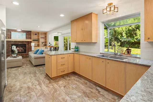 a kitchen with a sink stove and cabinets