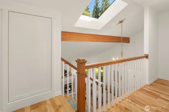 a view of a hallway with stairs