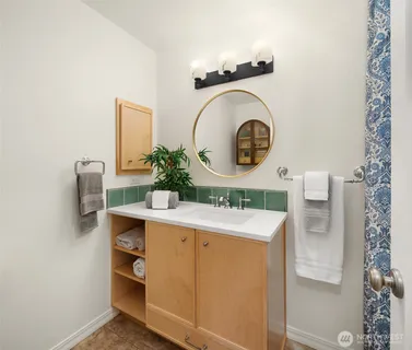 a room with a sink and a mirror