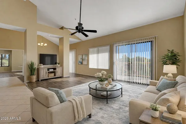 a living room with furniture and a flat screen tv
