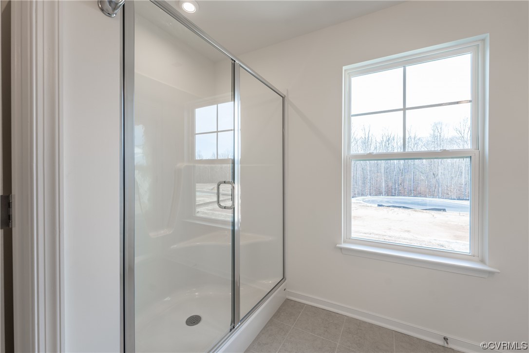 18609 Palisades Ridge Moseley, VA 23120 - Photo 24 of 50 a bathroom with a glass shower door