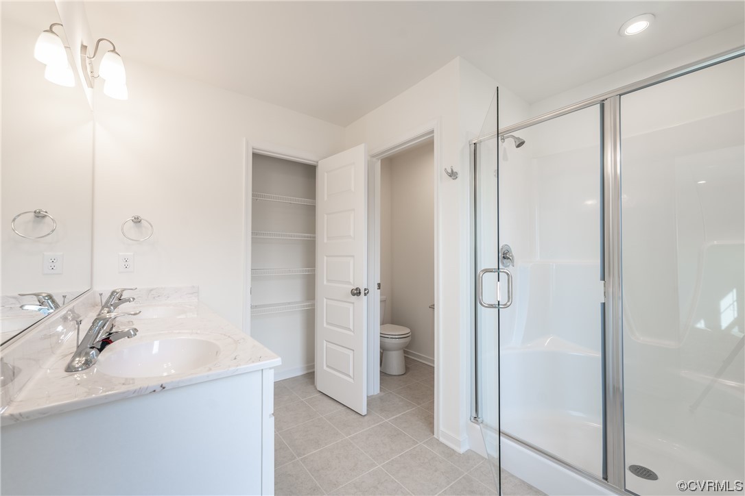 18609 Palisades Ridge Moseley, VA 23120 - Photo 25 of 50 a bathroom with a granite countertop sink shower and a mirror