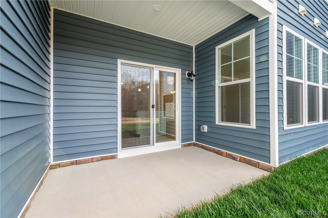 18609 Palisades Ridge Moseley, VA 23120 - Photo 33 of 50 a view of backyard with large windows