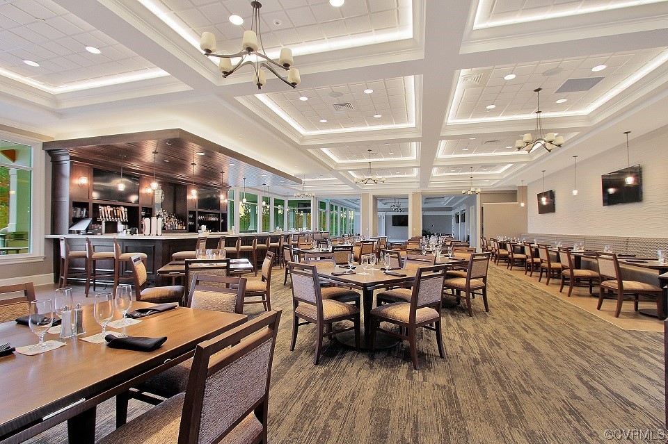 18609 Palisades Ridge Moseley, VA 23120 - Photo 47 of 50 a room with lots of wooden furniture a large window and furniture