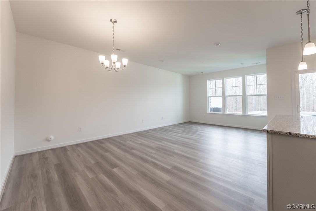 18609 Palisades Ridge Moseley, VA 23120 - Photo 9 of 50 an empty room with wooden floor and windows