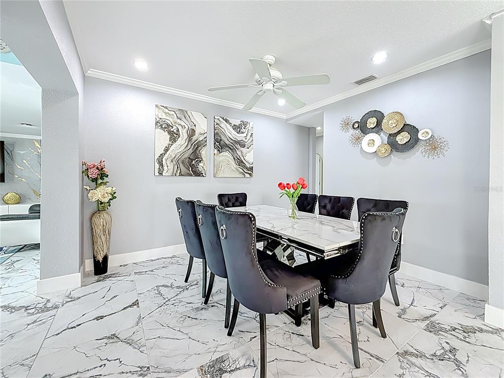 14186 West Parsley Drive Madeira Beach, FL 33708 - Photo 13 of 57 a view of a dining room with furniture