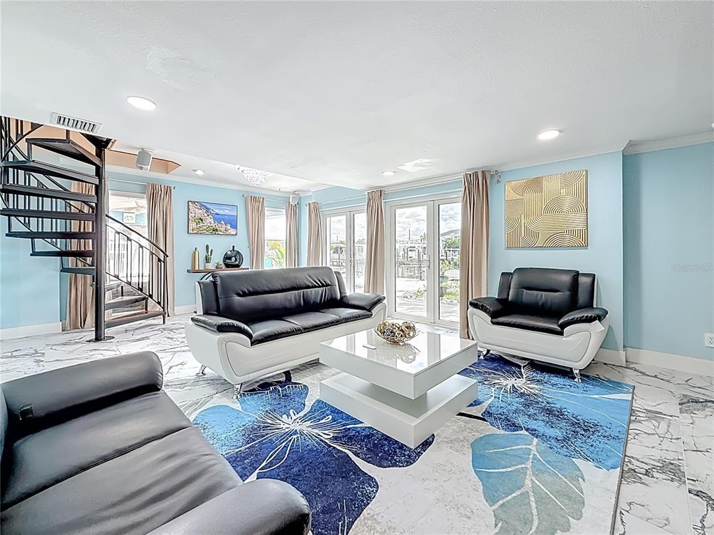 14186 West Parsley Drive Madeira Beach, FL 33708 - Photo 18 of 57 a living room with furniture and a large window