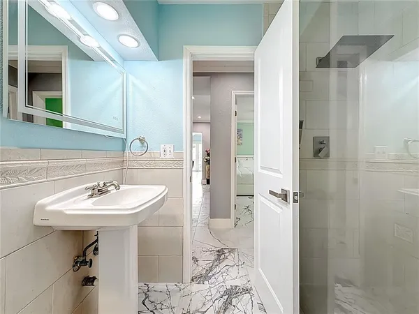 a outdoor living space with furniture and a flat screen tv