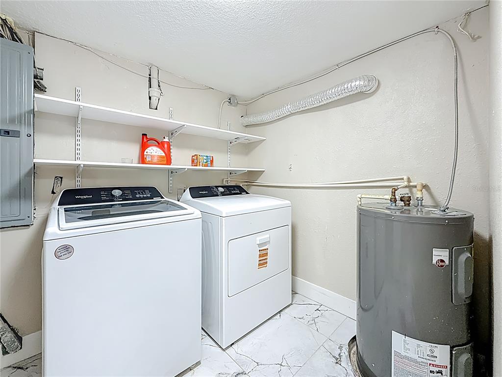 14186 West Parsley Drive Madeira Beach, FL 33708 - Photo 33 of 57 a utility room with washer and dryer