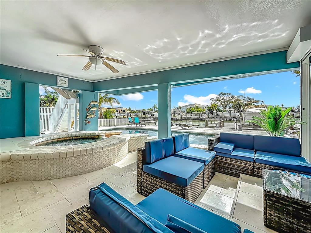 14186 West Parsley Drive Madeira Beach, FL 33708 - Photo 37 of 57 a living room with furniture and a large window