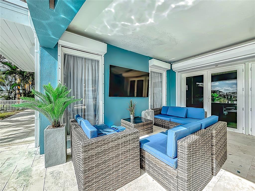 14186 West Parsley Drive Madeira Beach, FL 33708 - Photo 38 of 57 a living room with furniture and a potted plant