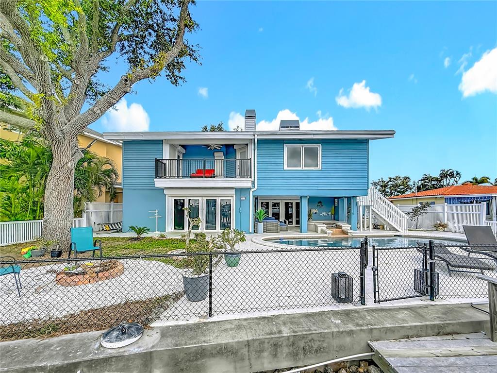 14186 West Parsley Drive Madeira Beach, FL 33708 - Photo 50 of 57 a front view of a house with a yard