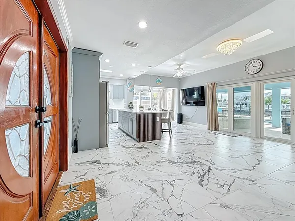 a kitchen with stainless steel appliances a refrigerator and cabinets